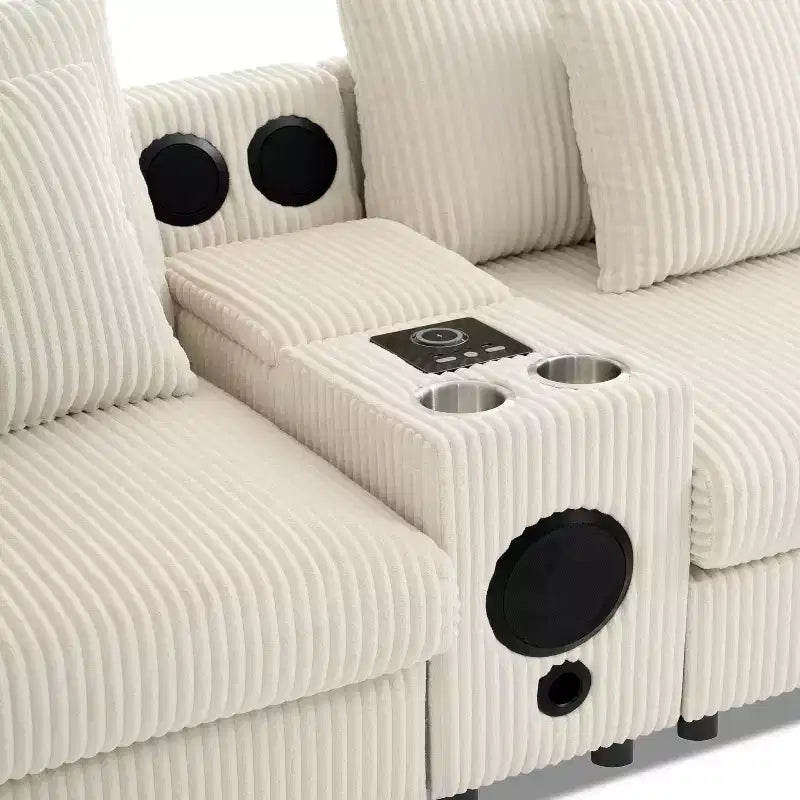 Divano componibile a L in velluto a coste grigio scuro/crema con Bluetooth, USB e portabicchieri – 4 posti